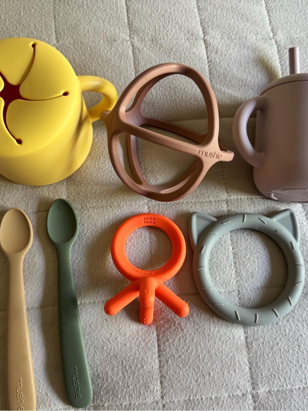 Mushie lot of teethers, spoons, snack catcher, sippy cup